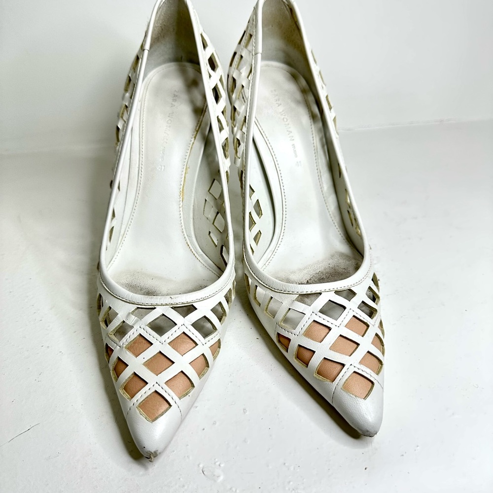 White laser cut leather heels